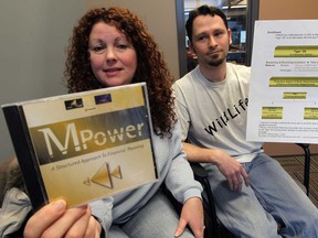 In this file photo, Lori Wright, left, and her boyfriend Matthew Pare, shown here Feb. 19, 2013, are fighting an order to pay the Canada Revenue Agency more than $120,000 after filing their taxes through the Fiscal Arbitrators. They were referred to the discredited tax organization after signing up with DSC Lifestyle Services, a personal finance company that owes millions to investors in Windsor and across the country. (NICK BRANCACCIO/The Windsor Star)