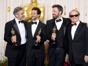 (L-R) Producers George Clooney and Grant Heslov and actor-producer-director Ben Affleck, winners of the Best Picture award for "Argo," with presenter Jack Nicholson pose in the press room during the Oscars held at Loews Hollywood Hotel on February 24, 2013 in Hollywood, California. (Photo by Jason Merritt/Getty Images)