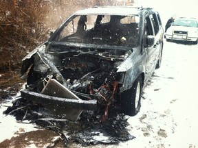 A Chrysler Town and Country minivan was destroyed in a vehicle fire on Ojibway Parkway on Feb. 4, 2013. (Dax Melmer/The Windsor Star)