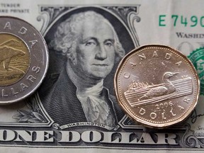 File photo of American and Canadian currency. (Windsor Star files)