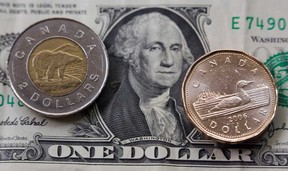File photo of American and Canadian currency. (Windsor Star files)