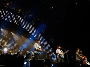 Ben Lovett, Marcus Mumford, Winston Marshall and Ted Dwane of Mumford and Sons perform live on stage at the 02 Arena on December 11, 2012 in London, England. (Photo by Simone Joyner/Getty Images)