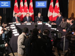 Justice Minister Rob Nicholson, centre, former NHLer Sheldon Kennedy (left) and Vince Hawkes, right, Ontario Provincial Police Deputy Commissioner, appear at a news conference in Toronto on Monday, Feb. 4, 2013. Nicholson announced government plans to stiffen penalties for child-sex offenders and create a victims bill of rights. THE CANADIAN PRESS/Colin Perkel