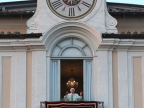 Pope Benedict XVI greets faithful from his summer residence of Castel Gandolfo, the scenic town where Pope Benedict XVI will spend his first post-Vatican days and made his last public blessing as pope,Thursday, Feb. 28, 2013. (AP Photo/Luca Bruno)