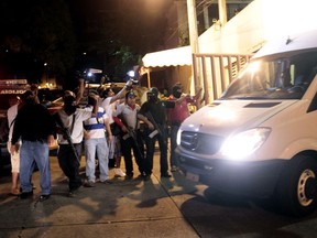 Statal police escort a van with twelve Spanish citizens and a Mexican woman leaving the Office of Justice of Guerrero State in Acapulco on February 4, 2013. Acapulco's mayor Luis Walton confirmed that six Spanish women, part of a group of 13 tourists, were raped by a band of criminals near the touristic port of Acapulco. AFP PHOTO/ Pedro PARDO