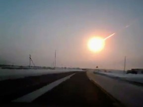 In this frame grab made from a video done with a dashboard camera, on a highway from Kostanai, Kazakhstan, to Chelyabinsk region, Russia, provided by Nasha Gazeta newspaper, on Friday, Feb. 15, 2013 a meteorite contrail is seen. A meteor streaked across the sky of Russia’s Ural Mountains on Friday morning, causing sharp explosions and reportedly injuring around 100 people, including many hurt by broken glass. (AP Photo/Nasha gazeta, www.ng.kz)