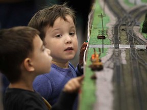 Jack Tann, 5, and his friend, Matthew Fullerton, 5, left, both from LaSalle, have fun checking out the model train sets while at the 18th annual Essex Train Show at Essex High School in Essex, Ont., Sunday, February 24, 2013.  (DAX MELMER/The Windsor Star)