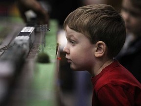 Owen Kouvelas, 4, gets a closer look at a model train set while at the 18th annual Essex Train Show at Essex High School in Essex, Ont., Sunday, February 24, 2013.  (DAX MELMER/The Windsor Star)