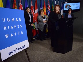 Meghan Rhoad, women's rights researcher at Human Rights Watch speaks during a press conference on Parliament Hill in Ottawa on Feb. 13, 2013. The press conference was regarding the release of her report titled "Those Who Take Us Away: Abusive Policing and Failures in Protection of Indigenous Women and Girls in Northern British Columbia, Canada." THE CANADIAN PRESS/Sean Kilpatrick