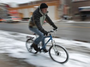 Windsor Star reporter Doug Schmidt rides his bike to work year-around including snowy days like Friday, Feb. 8, 2013.   (DAN JANISSE/The Windsor Star)