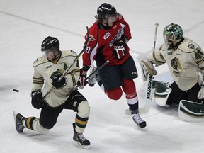 London goalie Anthony Stolarz, right, and teammate Olli Maata brace for a shot as Windsor's Ty Bilcke gets in the mix Thursday at the WFCU Centre. (DAN JANISSE/The Windsor Star)
