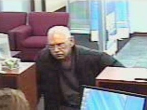 This Saturday, Feb. 9, 2013 surveillance photo provided by the FBI shows 73-year-old Walter Unbehaun, an ex-convict from Rock Hill., S.C., during a bank robbery in Niles, Ill. Unbehaun allegedly told investigators he became accustomed to life in prison and intended to get caught for a weekend bank robbery so he could live his final years behind bars.