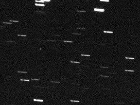 This image courtesy of NASA obtained February 15, 2013 shows asteroid 2012 DA14 (the white dot in the middle of picture) taken by the FRAM Telescope in Argentina, part of the GLObal Robotic-telescopes Intelligent Array (GLORIA) project, in advance of its close - but safe - approach to Earth. It was obtained at 0:53 UTC on February 15, 2013 (7:53 p.m. EST, or 4:53 p.m. PST, on February 14, 2013) AFP PHOTO / NASA/GLORIA project/FRAM