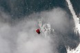 United States’ Lindsey Vonn is airlifted by an helicopter after crashing during the women's super-G course, at the Alpine skiing world championships in Schladming, Austria, Tuesday, Feb.5, 2013. (AP Photo/Luca Bruno)