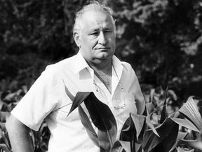 In this file photo, Eugene Whelan, a man out standing in this field. Whelan is pictured here July 25, 1985. Former Liberal Essex MP and senator Eugene Whelan, who turned 88 last year, died Tuesday, Feb. 19, 2013, at his home in Amherstburg, Ont., from complications following a stroke last summer. (BEV MacKENZIE/The Windsor Star)