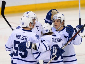 Toronto's Mika Grabovski, second from right, celebrates his first-period goal with teammates Korbinian Holzer, from left, Dion Phaneuf and Nikolai Kulemin in Ottawa. (THE CANADIAN PRESS/Sean Kilpatrick)