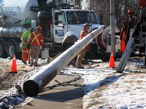 Enwin crews replace a broken utility pole on the 900 block of Tecumseh Road West following a collision where a driver was charged with impaired driving, early Monday morning, February 25, 2013. Tecumseh Road was blocked for a portion of the morning, but later reopened with traffic moving on both north and south bound lanes. (NICK BRANCACCIO/The Windsor Star)