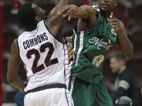 Windsor's Chris Commons, left, pressures Montreal's J.R. Harrison at the WFCU Centre. (DAN JANISSE/The Windsor Star)