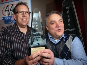 CAW's Dave Cassidy, left, and WESPY founder Domenic Papa pose with a WESPY award at Wednesday's news conference. (NICK BRANCACCIO/The Windsor Star)