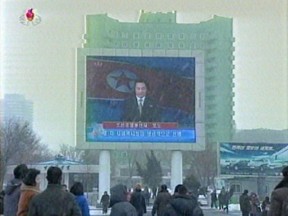 North Koreans watch an announcer reading a statement on the country's nuclear test on a large television screen in front of Pyongyang's railway station. (AFP PHOTO / NORTH KOREAN TV)