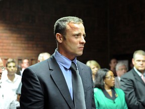 South African Olympic sprinter Oscar Pistorius appears on February 19, 2013 at the Magistrate Court in Pretoria. (AFP PHOTO / STEPHANE DE SAKUTIN)