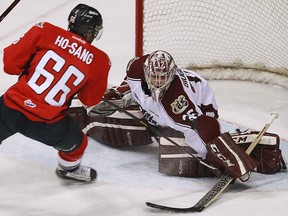 Windsor's Josh Ho-Sang, left, is stopped by Petes goalie Michael Giugovaz at the WFCU Centre.       (TYLER BROWNBRIDGE/The Windsor Star)