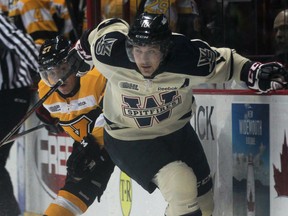 Windsor's Patrick Sieloff, right, battles Kingston's Jean Dupuy at the WFCU Centre. (DAX MELMER/The Windsor Star)