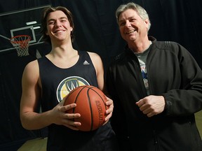 Lancers forward Evan Matthews, left, takes a break before practice with his father Duane Matthews. (TYLER BROWNBRIDGE/The Windsor Star)