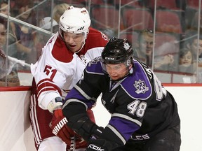 Ex-Spitfire Andrei Loktionov, right, is checked by Justin Bernhardt of the Coyotes in 2010. (Photo by Christian Petersen/Getty Images)