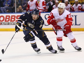 Blues forward Jaden Schwartz, left, is checked by Detroit's Daniel Cleary at the Scottrade Center.(Photo by Dilip Vishwanat/Getty Images)