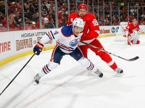 Ex-Spit Taylor Hall, left, is checked by Detroit's Niklas Kronwall at Joe Louis Arena. (Photo by Dave Sandford/Getty Images)