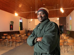 The Amherstburg First Baptist Church has recently been designated a National Historic Site. The Pastor of the church, Olaniyi Afolabi poses in front of it Friday, Feb. 22, 2013.  (DAN JANISSE/The Windsor Star)
