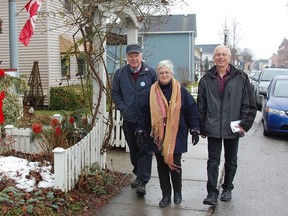 Amherstburg Heritage committee chairman John McDonald, from left, Coun. Carolyn Davies and committee member Robert Honor discuss the work being done on a registry of historically significant buildings in the downtown area of Amherstburg while walking on Dalhousie Street. (Julie Kotsis/The Windsor Star)