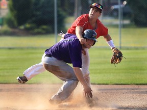 Windsor Junior Selects Joel Cooper, top, and Tecumseh Junior Thunder Andrew Cooper get tangled up at second base during their game at the Lacasse Park in Tecumseh, Ont. Friday, July 6, 2012. (Windsor Star / DAN JANISSE)