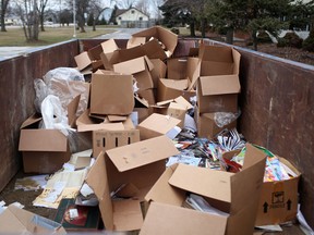 Boxes of school books sit in dumpsters outside the former St. Theresa Catholic School in Amhersburg, Ont., Monday, February 11, 2013.  (DAX MELMER/The Windsor Star)
