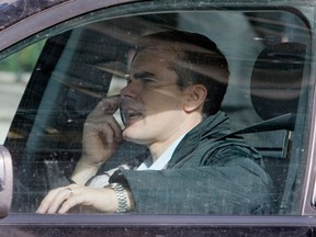 Talking on a cellphone while driving. (Postmedia News files)