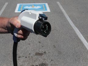 Tim Horton's in Oakville has installed an electric vehicle charging station for public use. The free service will charge electric cars or E-bikes. (JASON KRYK/ The Windsor Star)