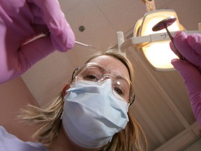 Files: Dental Hygenist Sara Cannon at a dentist's office in Ottawa. (Postmedia News files)
