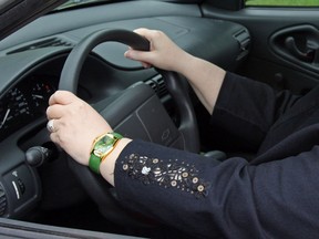 A woman driving a car in Canada. (Postmedia News files)
