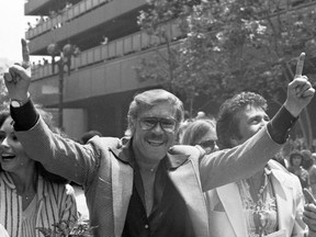 In this May 19, 1980 file photo, Los Angeles Lakers owner Jerry Buss gestures as the NBA championship team is honored with a parade in Los Angeles.(AP Photo/File)