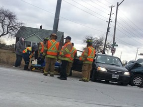 Paramedics remove a patient involved in a crash at County Road 42 and Lauzon Parkway on Wednesday, Feb. 20, 2013. (Pawel/Twitter)