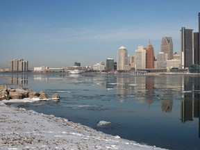 The Detroit skyline is reflected on an undisturbed Detroit River, Monday, February 25, 2013.   (DAX MELMER/The Windsor Star)