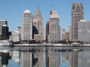 The Detroit skyline is reflected on a placid Detroit River, Saturday, February 9, 2013.  (DAX MELMER/The Windsor Star)