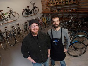 Ron Drouillard, right, and Chris Holt, two of the owners of the City Cyclery, are shown in their original location.  (TYLER BROWNBRIDGE / The Windsor Star)