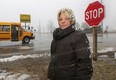 Kristine Cojocar on, Feb. 27, 2013, stands at the corner of County Rd. 42 and Renaud Line. Cojocar works at the Tofflemire Auto Centre at the corner and is concerned about the frequency of serious and fatal accidents at the intersection.    (DAN JANISSE/The Windsor Star)