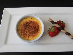 A classic crème brûlée with a baked rich egg custard and caramel glaze prepared by pastry chef Charles Liston at Sorelei’s Bistro on Wyandotte Street East in Windsor. (JASON KRYK / The Windsor Star)