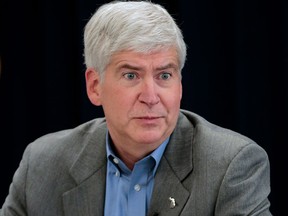 Rick Snyder, governor of Michigan, speaks during an event in Detroit, Michigan, U.S., on Thursday, Feb. 21, 2013. A fiscal emergency grips Detroit, according to a report ordered by Snyder, that opens a path to a state takeover of General Motors Co.’s home town, citing deficits that have stymied city officials after a $326.6 million gap last year. Photographer: Jeff Kowalsky/Bloomberg