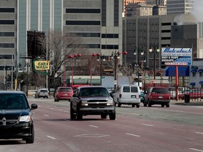 The city skyline stands as cars drive down a street in Detroit, Mich., on Feb. 21, 2013. (Jeff Kowalsky/Bloomberg)
