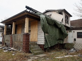 A derelict home and its dirty yard on Louis Avenue in Windsor, Ont. are shown in this 2010 file photo. (Tyler Brownbridge / The Windsor Star)