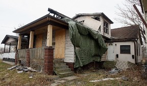 A derelict home and its dirty yard on Louis Avenue in Windsor, Ont. are shown in this 2010 file photo. (Tyler Brownbridge / The Windsor Star)